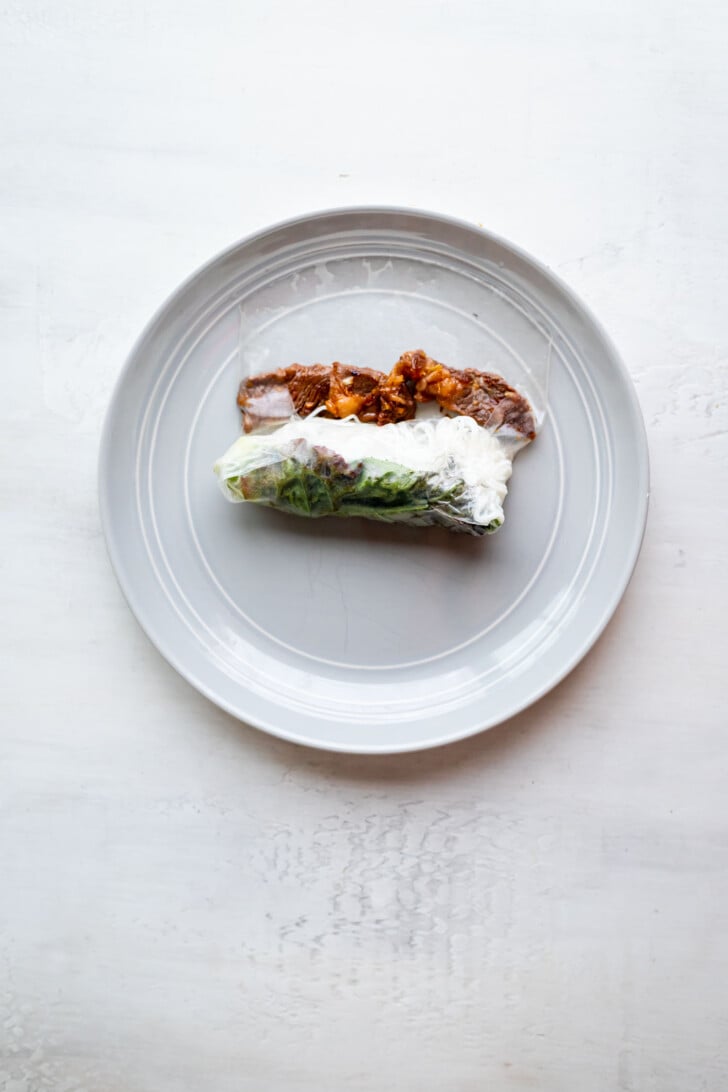 Beef spring roll rolled halfway.