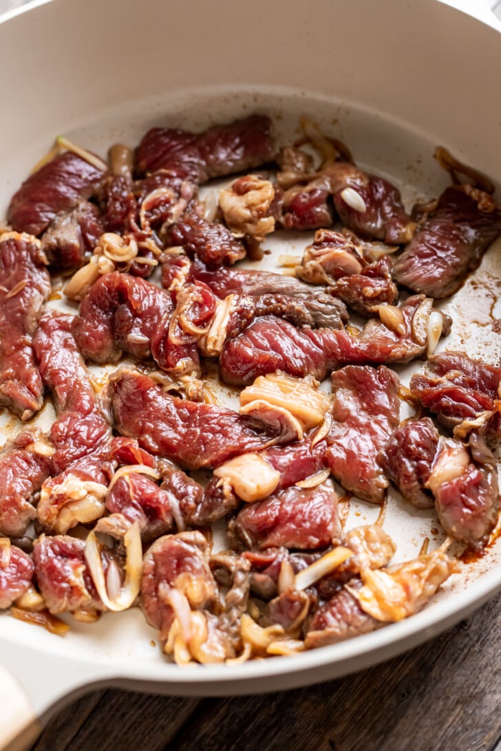 Seared ribeye steak in a fry pan.