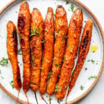 Vietnamese cinnamon roasted carrots on a white plate
