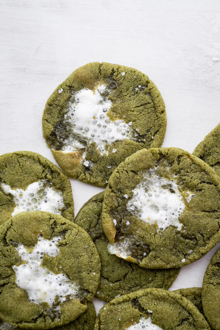 Matcha hot chocolate cookies stacked on top of each other.