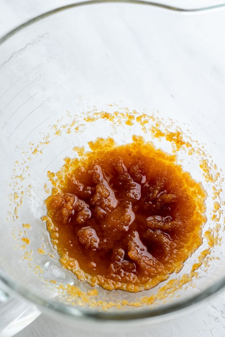 Mixed sugar and browned butter in a mixing bowl.