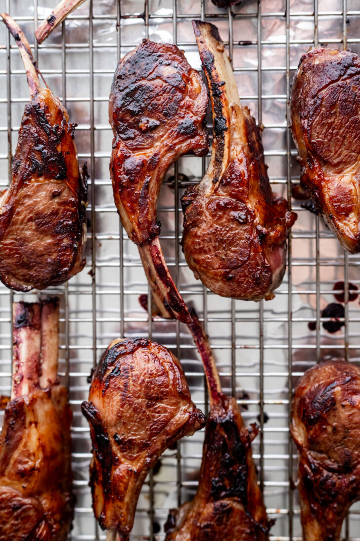 Baked lamb chops on a baking sheet.