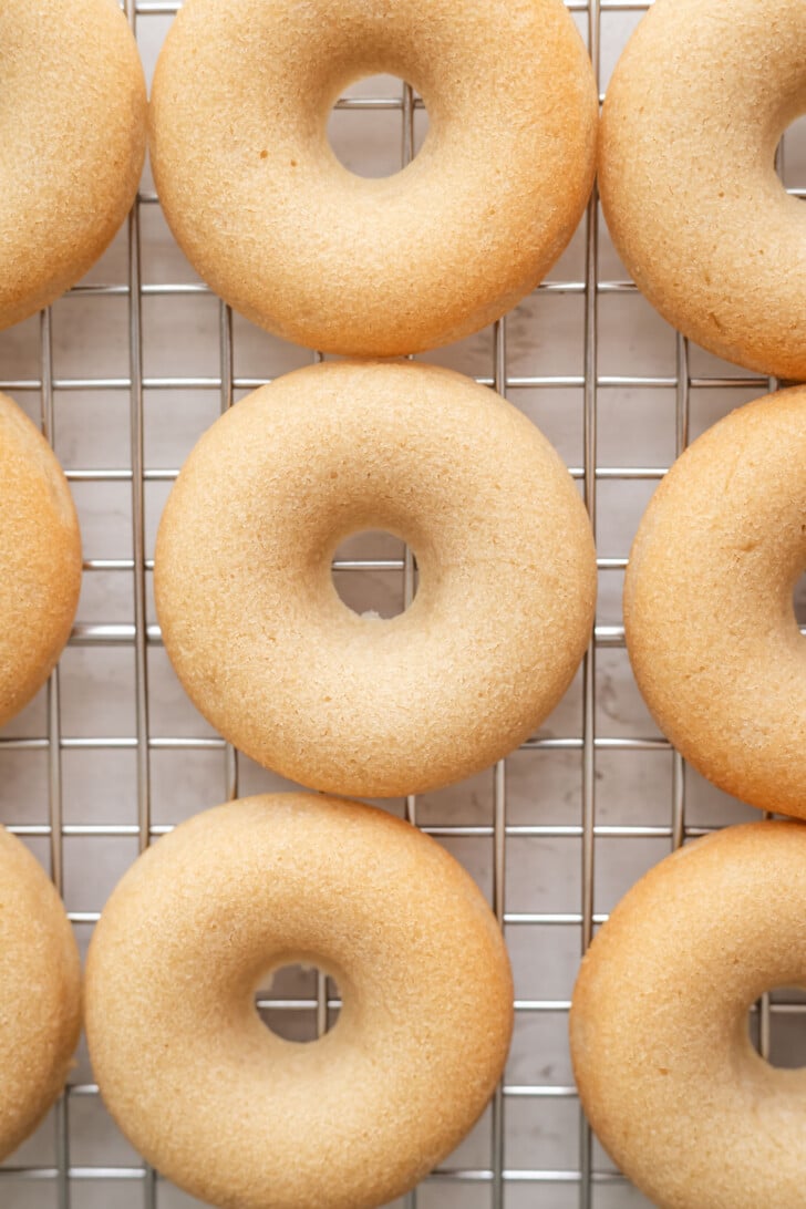 Baked mochi donuts on a cooling rack.